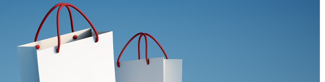 A Header Handel 6 (jpg) | Motiv ©FrankBoston - stock.adobe.com | © stock.adobe.com, Januar 2021 Weiße Einkaufstüten mit rotem Tragegriff auf blauem Hintergrund | Motiv ©FrankBoston - stock.adobe.com | © stock.adobe.com, Januar 2021